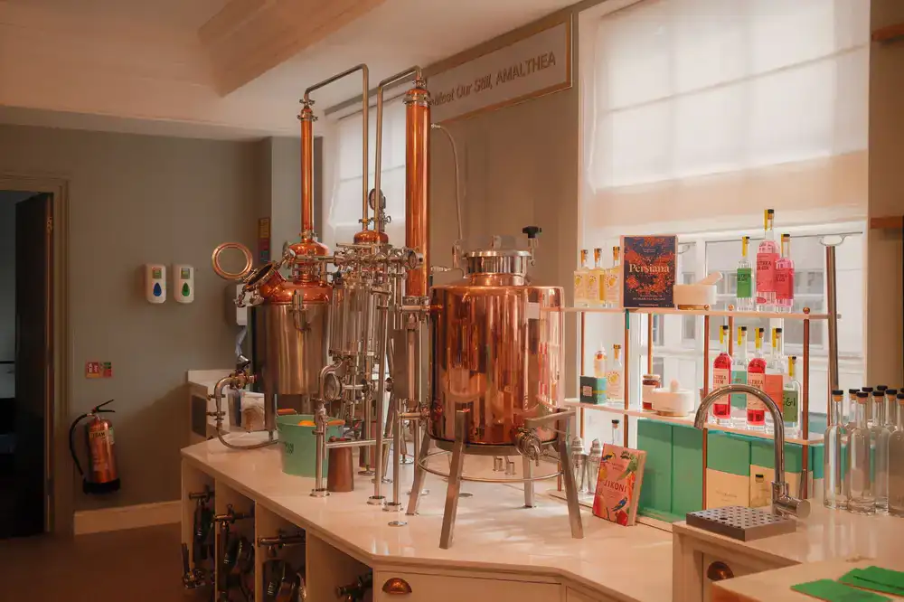 Copper distillation stills inside the gin distillery